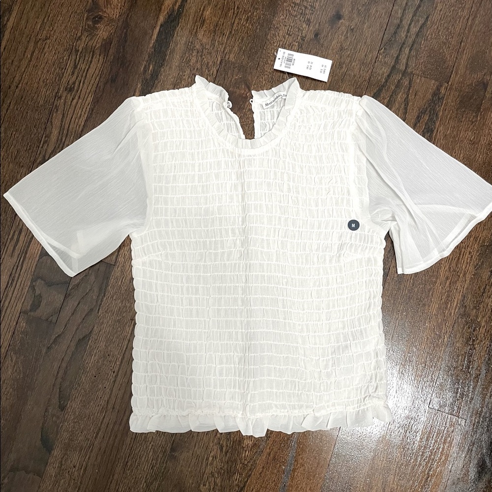 Abercrombie & Fitch mock neck blouse in black and white.
